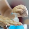 gel is dropping clear on the hand, women squeezing gel on finger the hand gel alcoholic 70 percent mixture with gelatin to prevent germs protect corona virus, covid19, hand Sanitizer